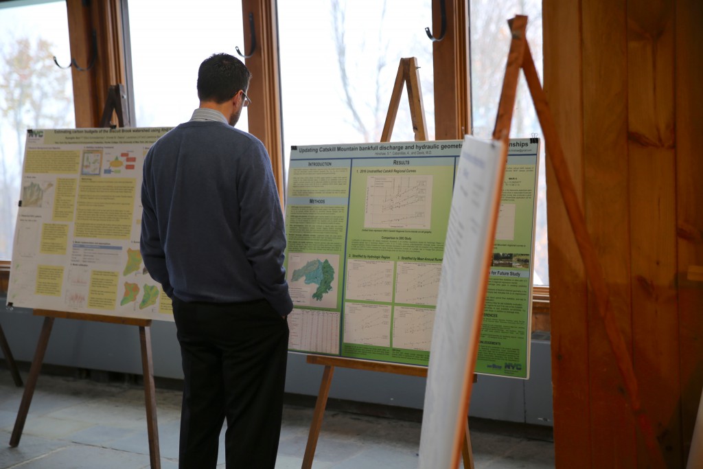 Man viewing research posters at the CERM Conference